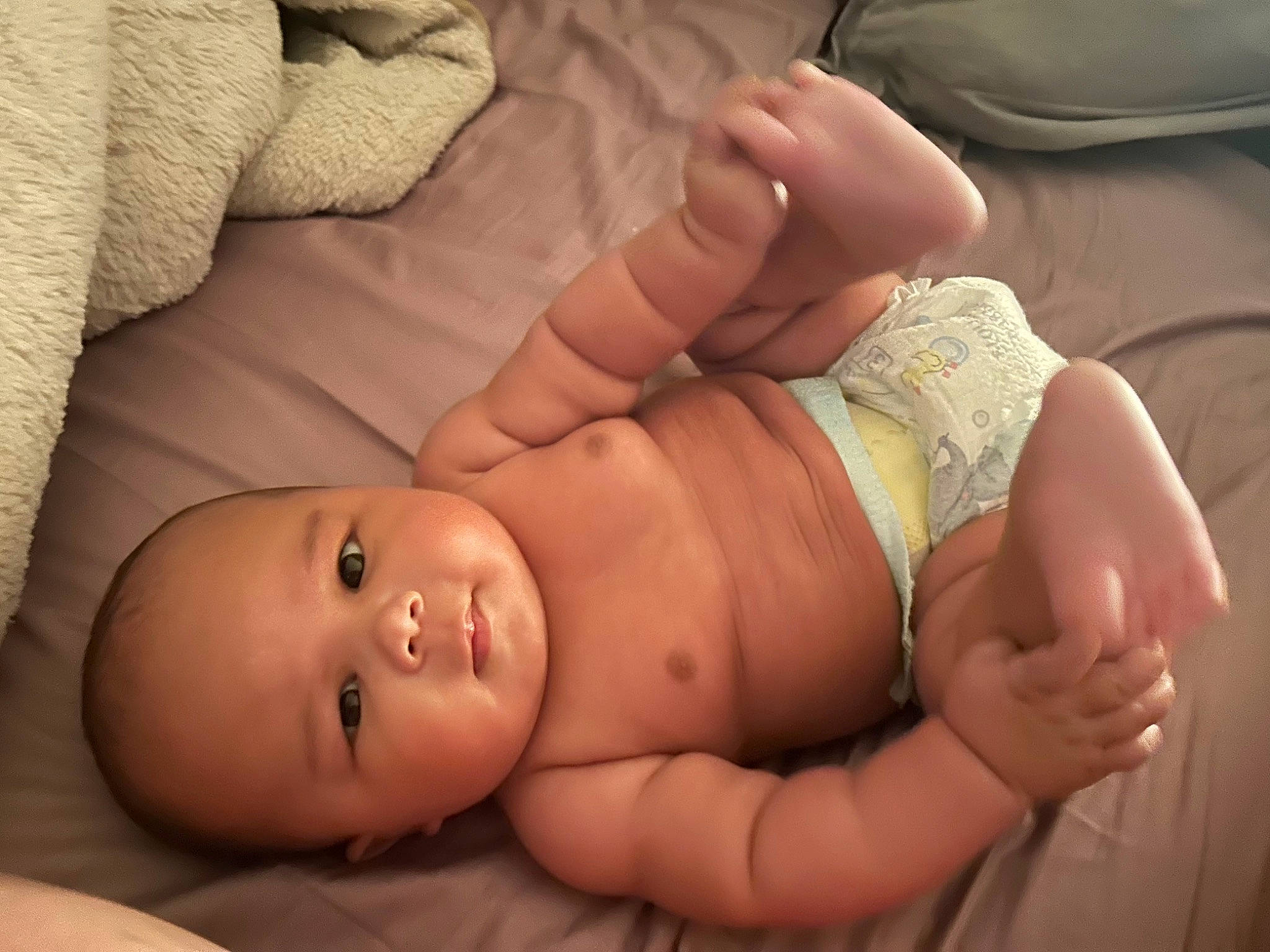 Kamari is registered to the contest to win money with this photo: abdomen, baby, chest, comfort, diaper, finger, gesture, hand, human_body, joint, leg, mouth, nail, neck, person, skin, stomach, thigh, thumb, toddler