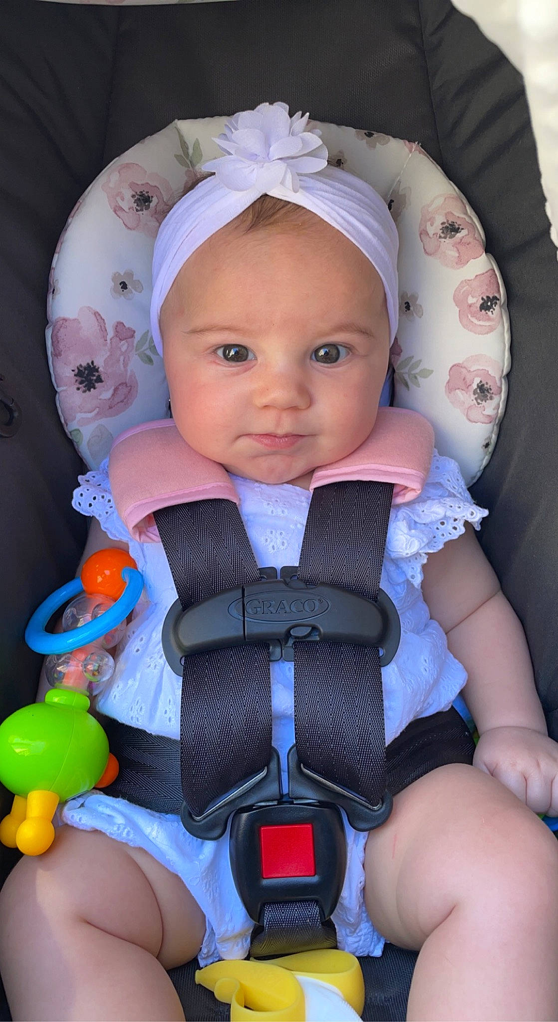 Amelia is registered to the contest to win money with this photo: baby, baby_carriage, baby_products, baby_toddler_clothing, car_seat, child, comfort, electric_blue, face, facial_expression, fun, head, organ, person, personal_protective_equipment, pink, product, purple, thigh, toddler