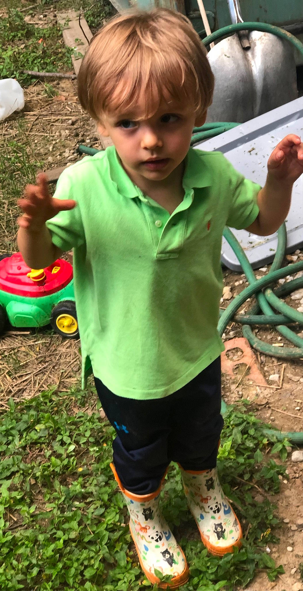 Liam is registered to the contest to win money with this photo: child, fun, grass, green, happy, leisure, people, people_in_nature, person, plant, play, recreation, sleeve, soil, sportswear, t_shirt, thigh, tire, toddler, toy