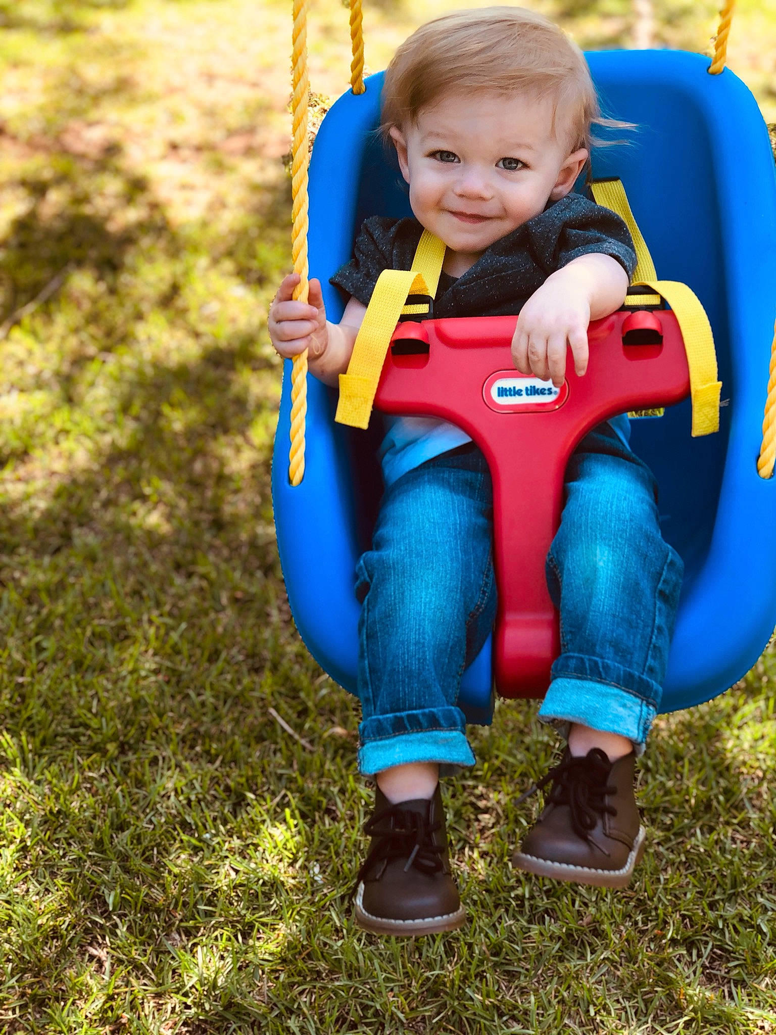 Ransom joined the competition — help win amazing prizes! baby, blue, child, fun, grass, joy, lifejacket, outdoor_play_equipment, person, personal_protective_equipment, plant, play, playground, public_space, recreation, skin, smile, swing, toddler, tree