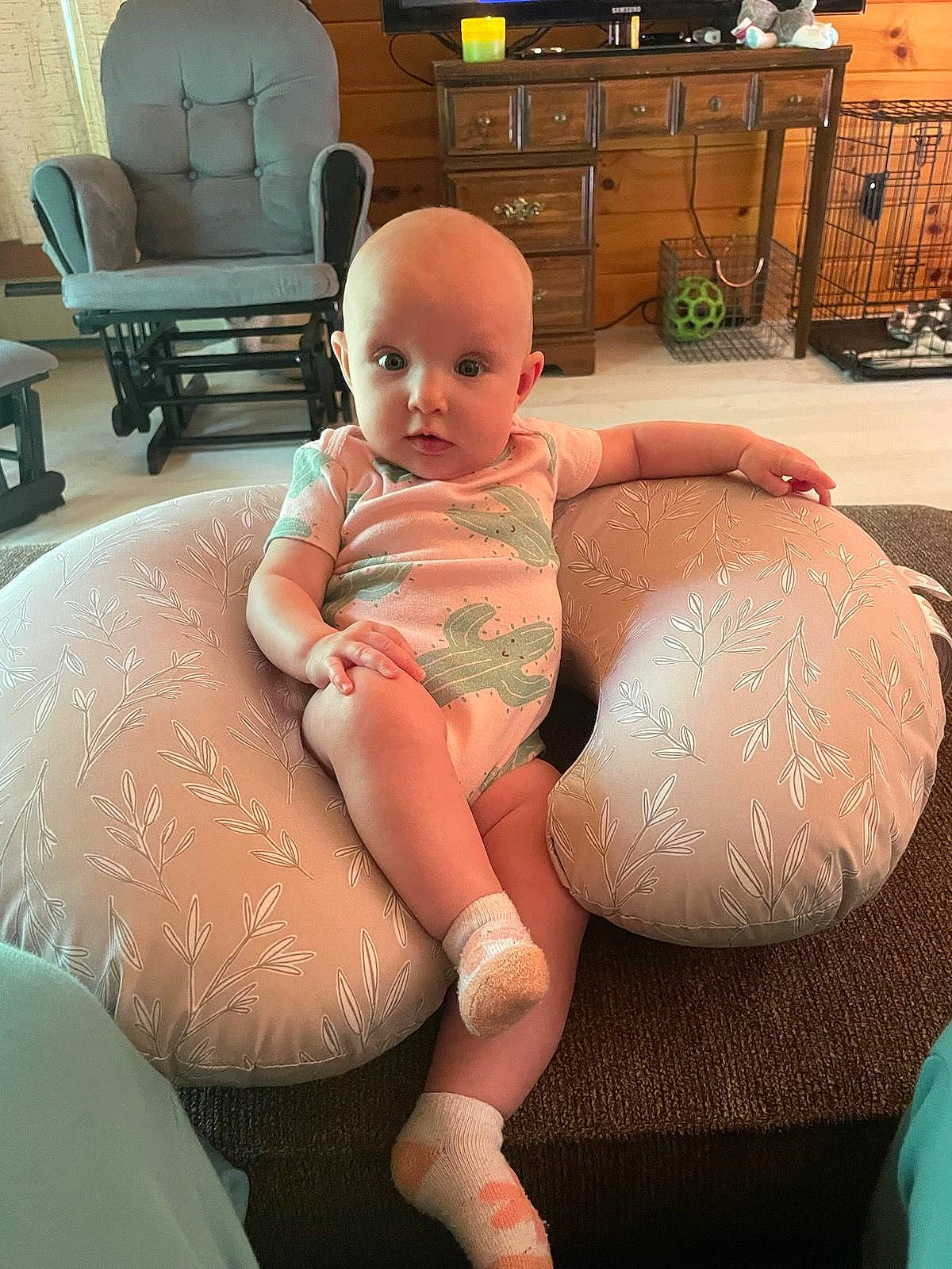 Madison is registered to the contest to win money with this photo: cabinetry, chest, comfort, finger, flooring, furniture, human_body, joint, knee, lap, leg, lingerie_top, mouth, muscle, person, pink, shoulder, skin, textile, thigh