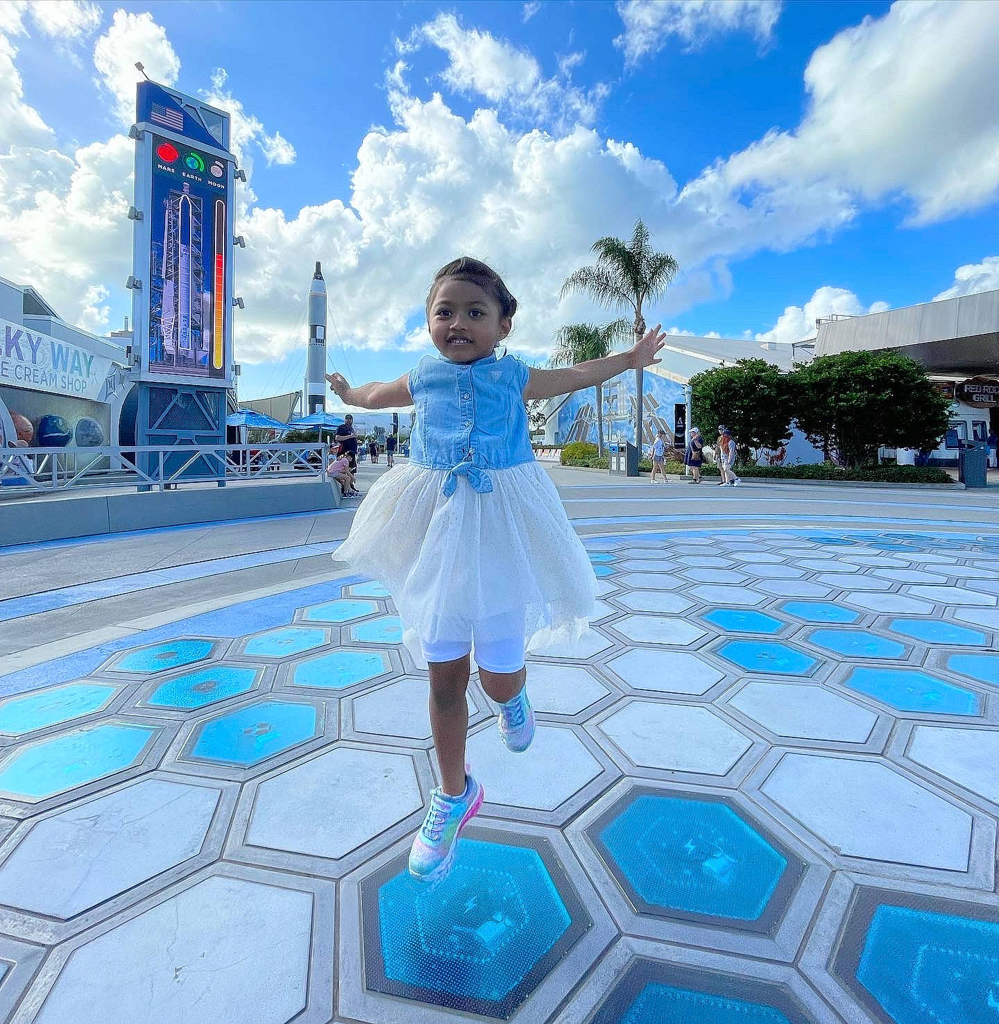 Eva is registered to the contest to win money with this photo: aqua, architecture, azure, blue, building, cloud, daytime, dress, flash_photography, fun, happy, joy, leisure, person, public_space, recreation, sky, summer, toddler, travel