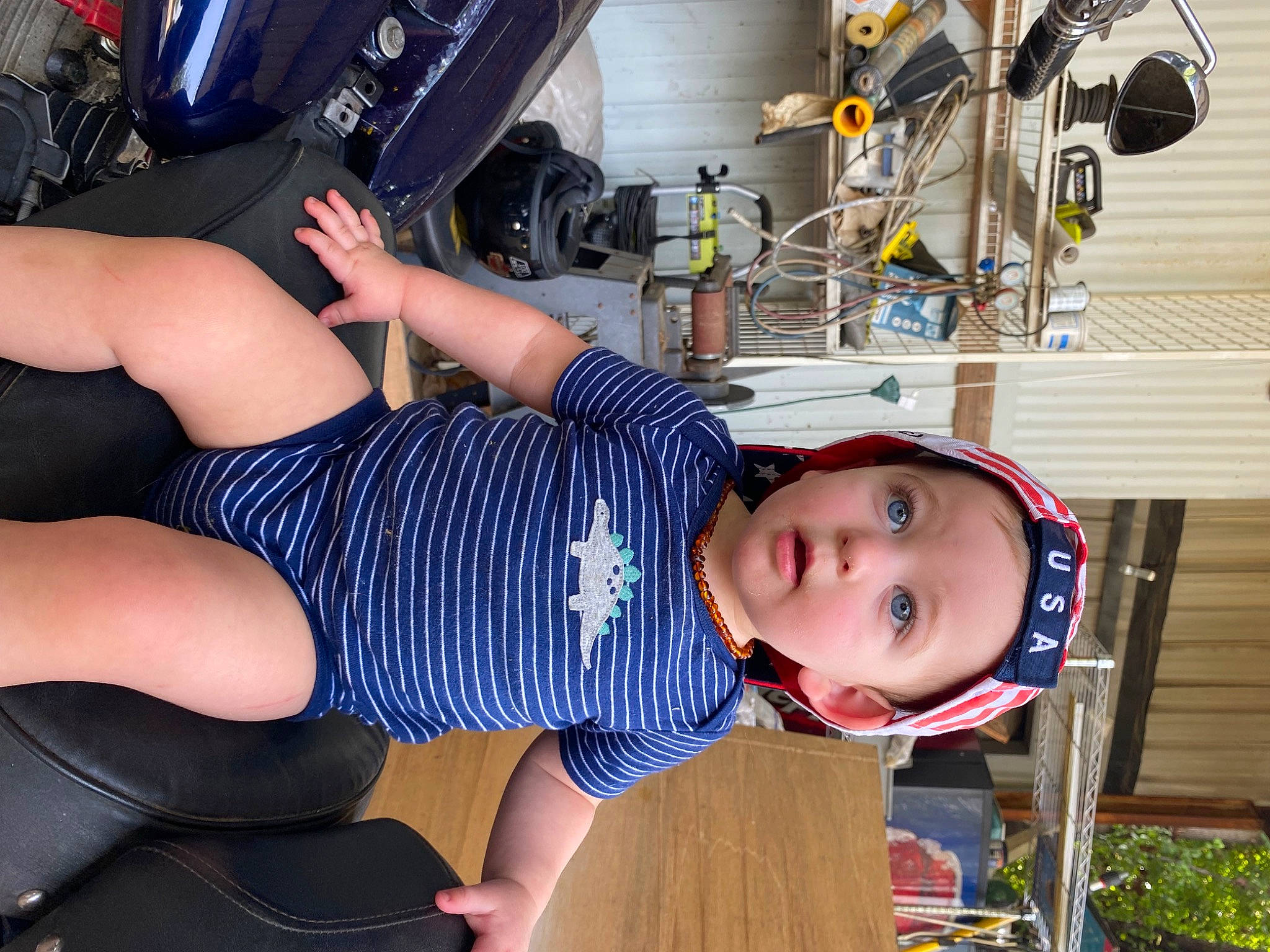 Jaxon joined the competition — help win amazing prizes! abdomen, auto_part, automotive_tire, baby, baby_toddler_clothing, chest, child, elbow, fun, hat, headwear, human_leg, knee, lap, machine, person, shorts, sitting, sportswear, surprise