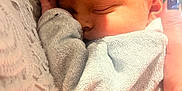 Valentin participe au concours pour gagner de l'argent avec cette photo : baby, newborn, sleeping, infant, person, closeup, soft, warm_light, hand, clothing, lace, skin, face, cozy, cuddle, toddler, portrait, human, nap, comfort