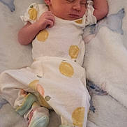 Elisia joined the competition — help win amazing prizes! newborn, baby, sleeping, infant, blanket, clothing, cute, pattern, animal_print, soft, cozy, pastel, socks, peaceful, lying_down, child, resting, indoors, portrait, toddler