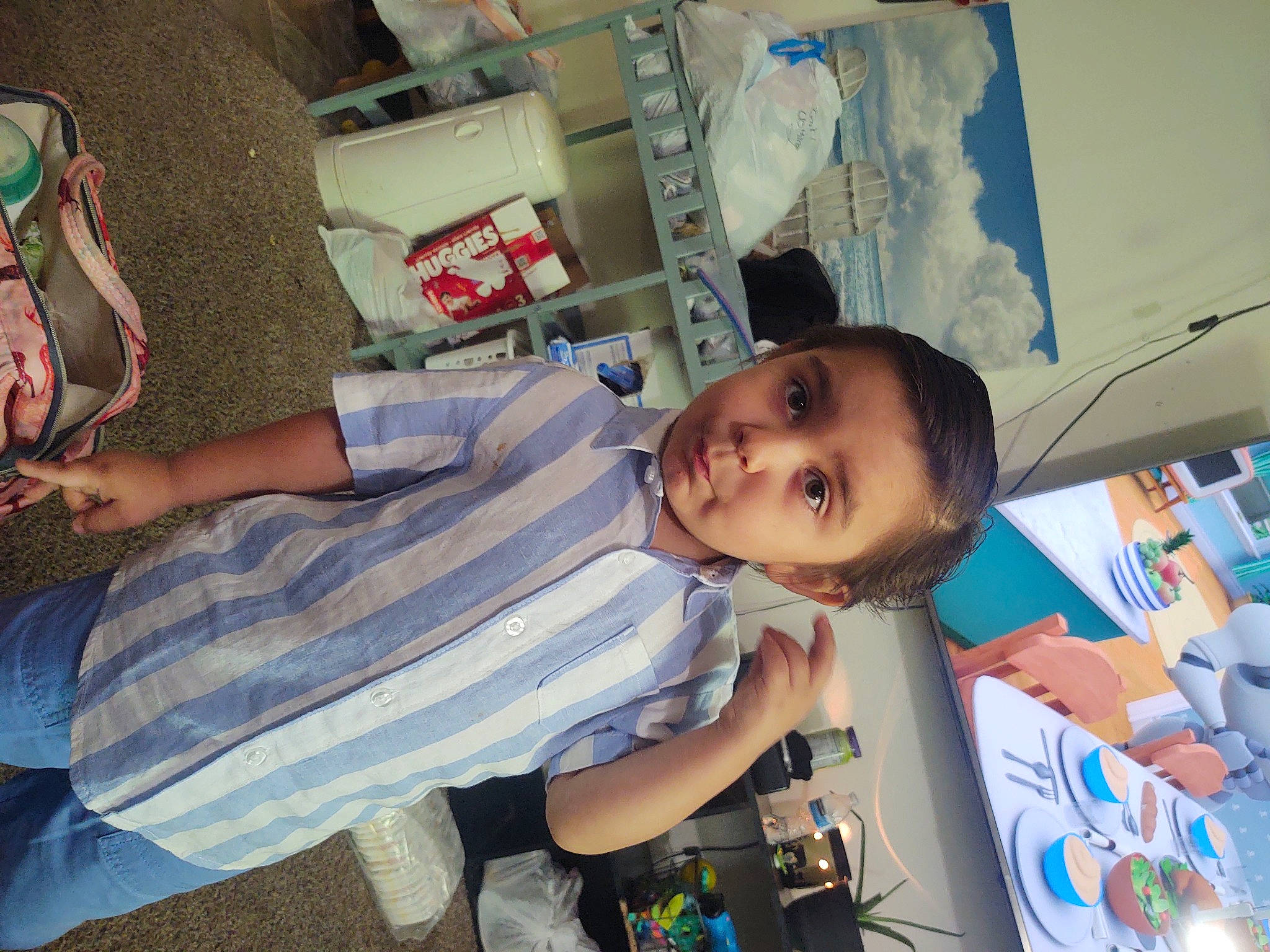 Roney is registered to the contest to win money with this photo: child, elbow, fun, human_leg, leisure, mouth, person, room, t_shirt, toddler, vacation, visual_arts