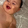 Noham a rejoint le concours — aidez-le/la à gagner de superbes lots ! baby, infant, bathtub, water, smile, laughing, chubby_cheeks, wet_skin, wet_hair, face, head, shoulder, arm, bath_time, closeup, portrait, joyful, cute, home, splash