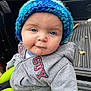 baby, beanie, bonnet, cap, clothing, coat, face, glove, hat, head, hood, hoodie, jacket, knitwear, pants, person, photography, portrait, sweater, sweatshirt