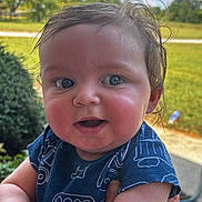 Jettson joined the competition — help win amazing prizes! baby, child, face, blue_eyes, outdoor, person, skin, hand, clothing, short_sleeve, grass, sky, clouds, greenery, portrait, cute, expression, holding, summer, daylight