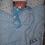 Jaxx is registered to the contest to win money with this photo: baby, blanket, pacifier, hat, sleeping, pillow, stars, moon, blue, white, infant, cozy, cute, resting, child, soft, warm, indoors, peaceful, portrait