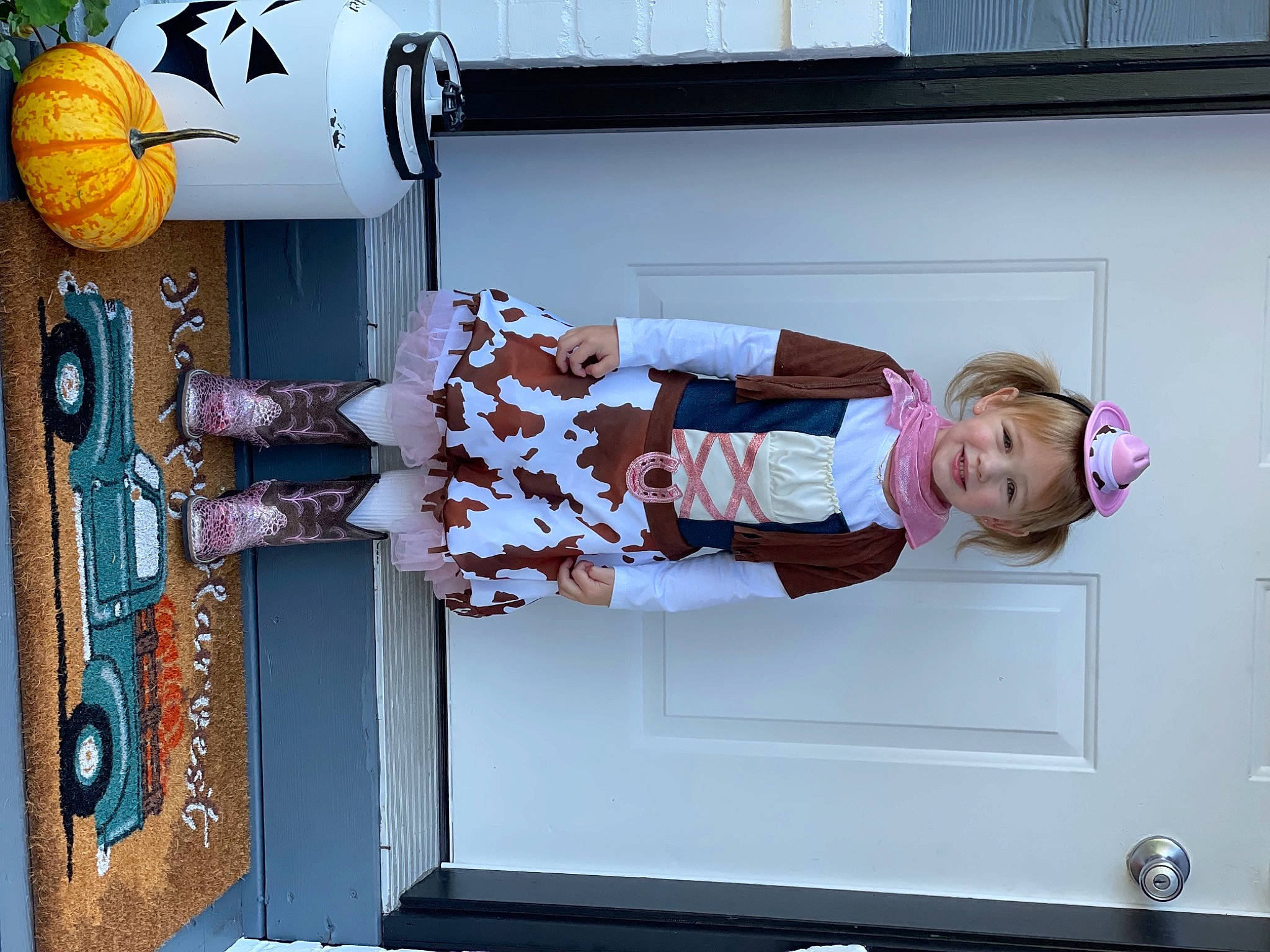 Sophia is registered to the contest to win money with this photo: baby, baby_toddler_clothing, calabaza, child, cucurbita, door, fun, gourd, joy, peach, person, pink, pumpkin, purple, room, smile, toddler, vegetable, wood