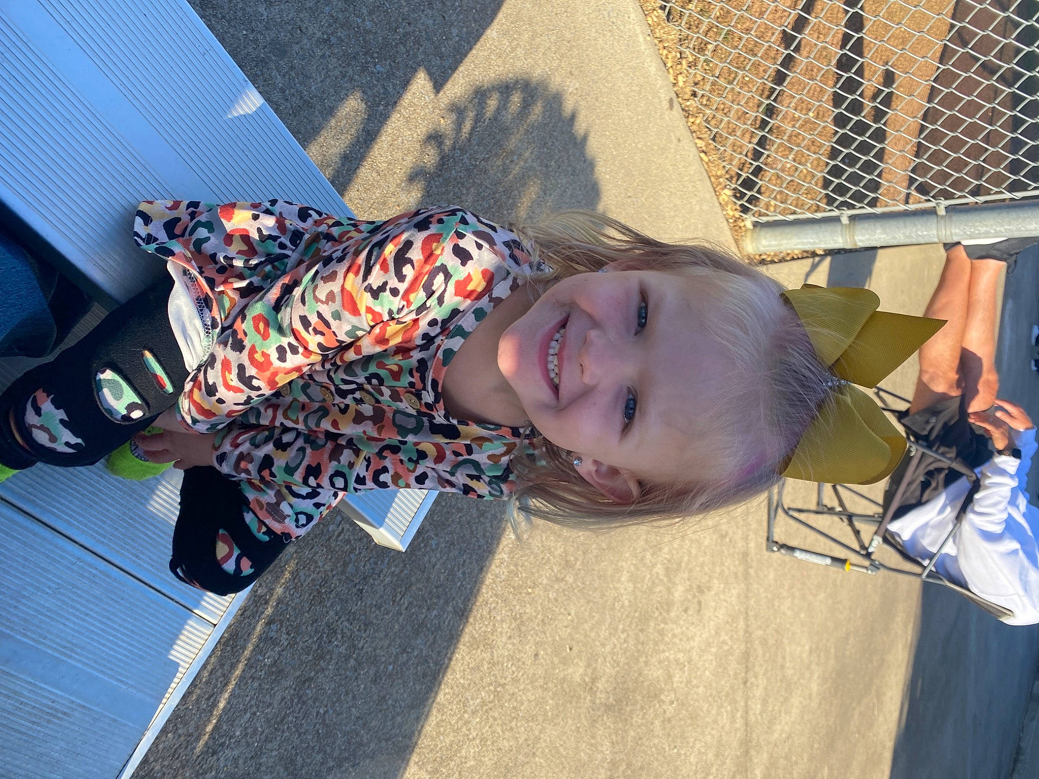 Jaceigh is registered to the contest to win money with this photo: child, electric_blue, eyewear, fashion_accessory, fence, fun, grass, happy, joy, leisure, mesh, pattern, person, recreation, shadow, sidewalk, smile, street, toddler, travel
