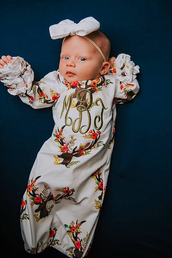 Mckinley is registered to the contest to win money with this photo: baby, baby_products, baby_toddler_clothing, bonnet, cheek, child, costume, day_dress, embellishment, person, portrait_photography, sleeve, toddler