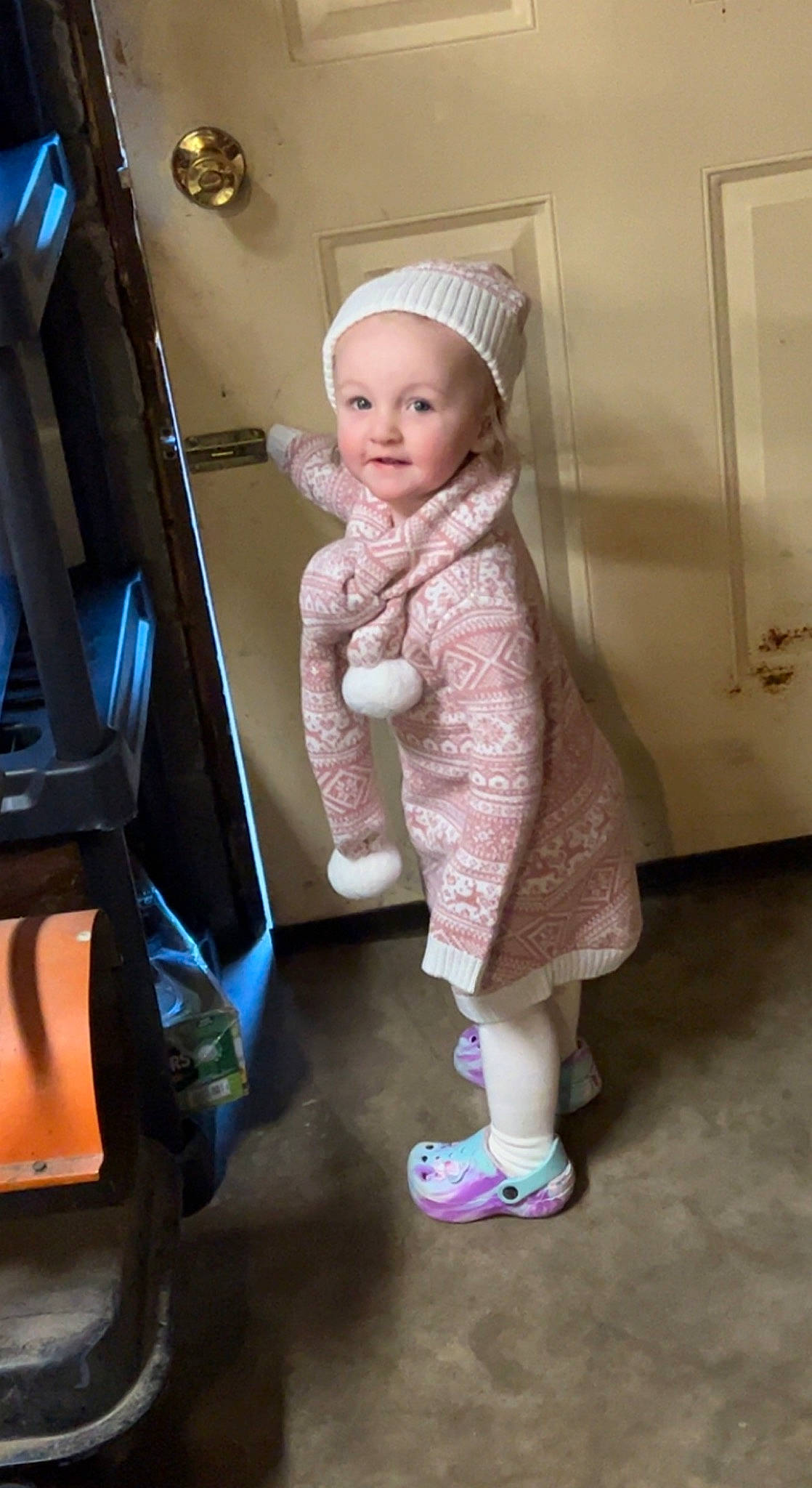 Huntleigh is registered to the contest to win money with this photo: baby, baby_toddler_clothing, blond, child, eye, fashion_design, flooring, fun, human_body, human_leg, knee, magenta, person, pink, room, sitting, skin, sleeve, smile, sock