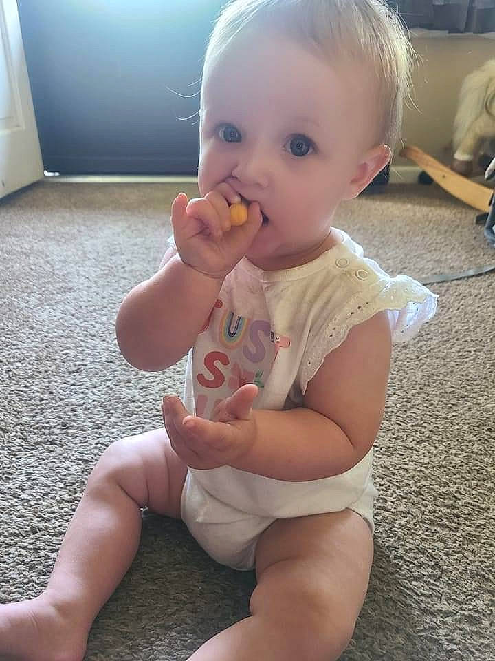 Huntleigh is registered to the contest to win money with this photo: baby, baby_toddler_clothing, cheek, chin, eye, finger, gesture, hair, hairstyle, hand, head, human_body, iris, joint, lip, mouth, nose, organ, person, skin