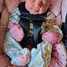 baby, infant, sleeping, car_seat, pink, mittens, onesie, child, cute, soft, cushion, floral, headband, straps, resting, newborn, comfort, indoors, safety, peaceful