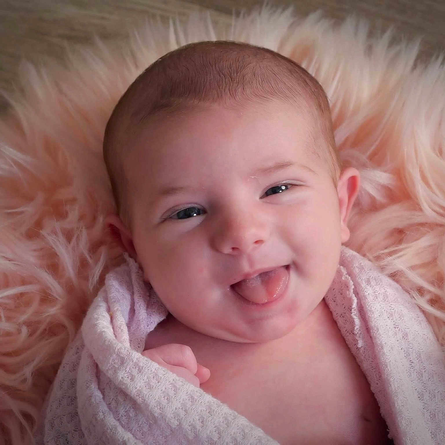 Mayven is registered to the contest to win money with this photo: baby, babylaughing, blanket, blonde, face, hair, happy, head, laughing, newborn, person, photography, portrait, smile, towel