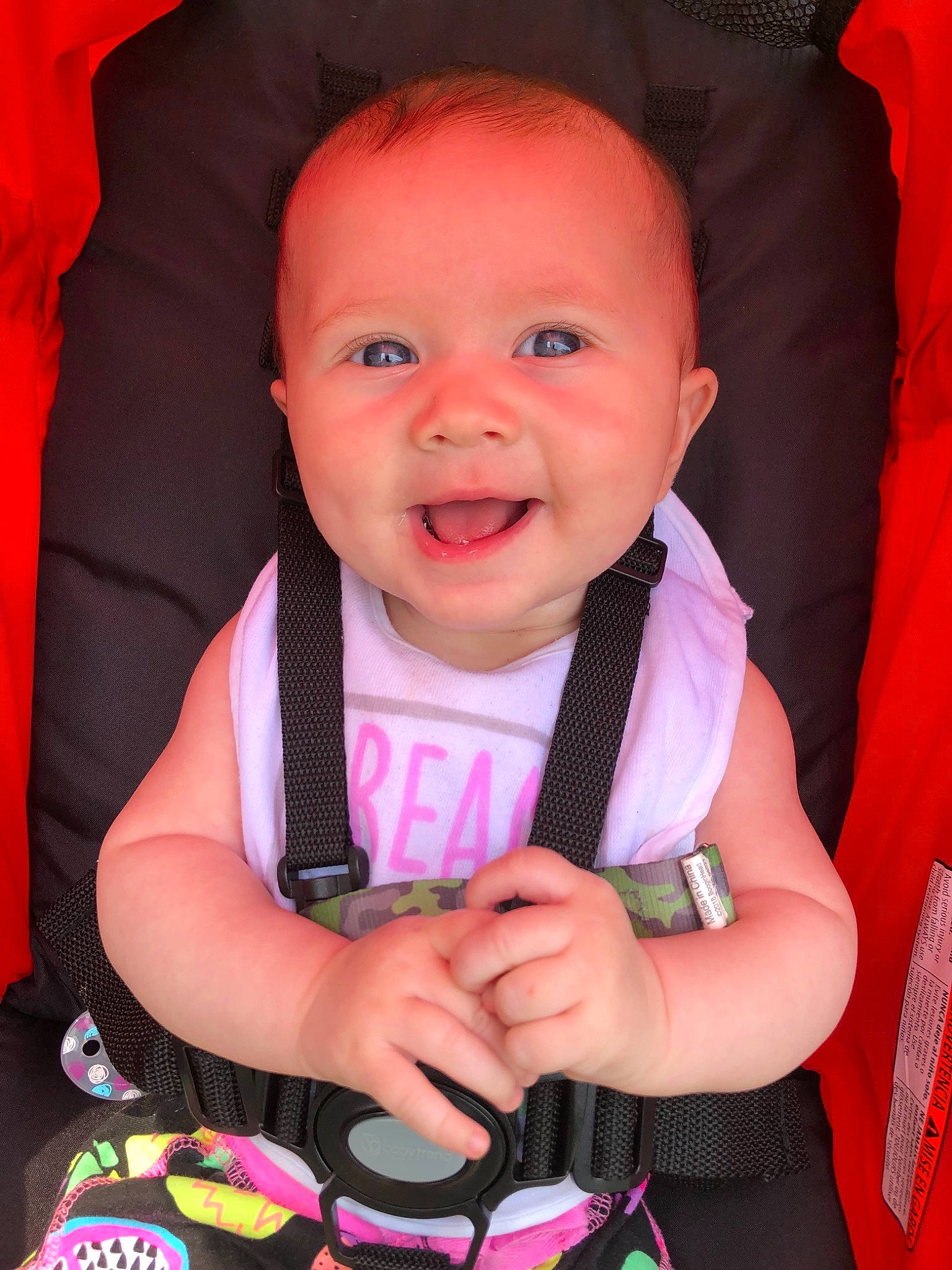 Briar is registered to the contest to win money with this photo: baby, baby_carriage, baby_products, baby_toddler_clothing, beauty, cheek, child, eye, face, facial_expression, fun, head, lip, organ, person, pink, product, red, skin, smile