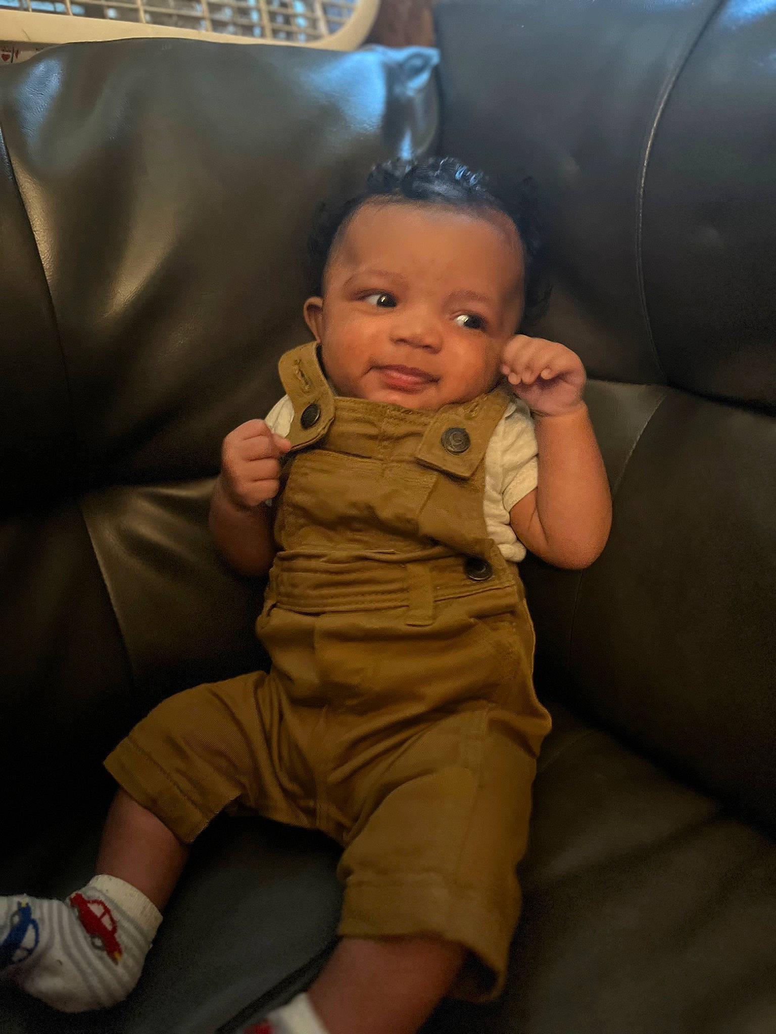 Jordon joined the competition — help win amazing prizes! auto_part, baby, baby_toddler_clothing, car_seat, chair, cheek, comfort, couch, finger, flooring, foot, fun, gas, gesture, human_leg, person, sitting, sock, thigh, thumb
