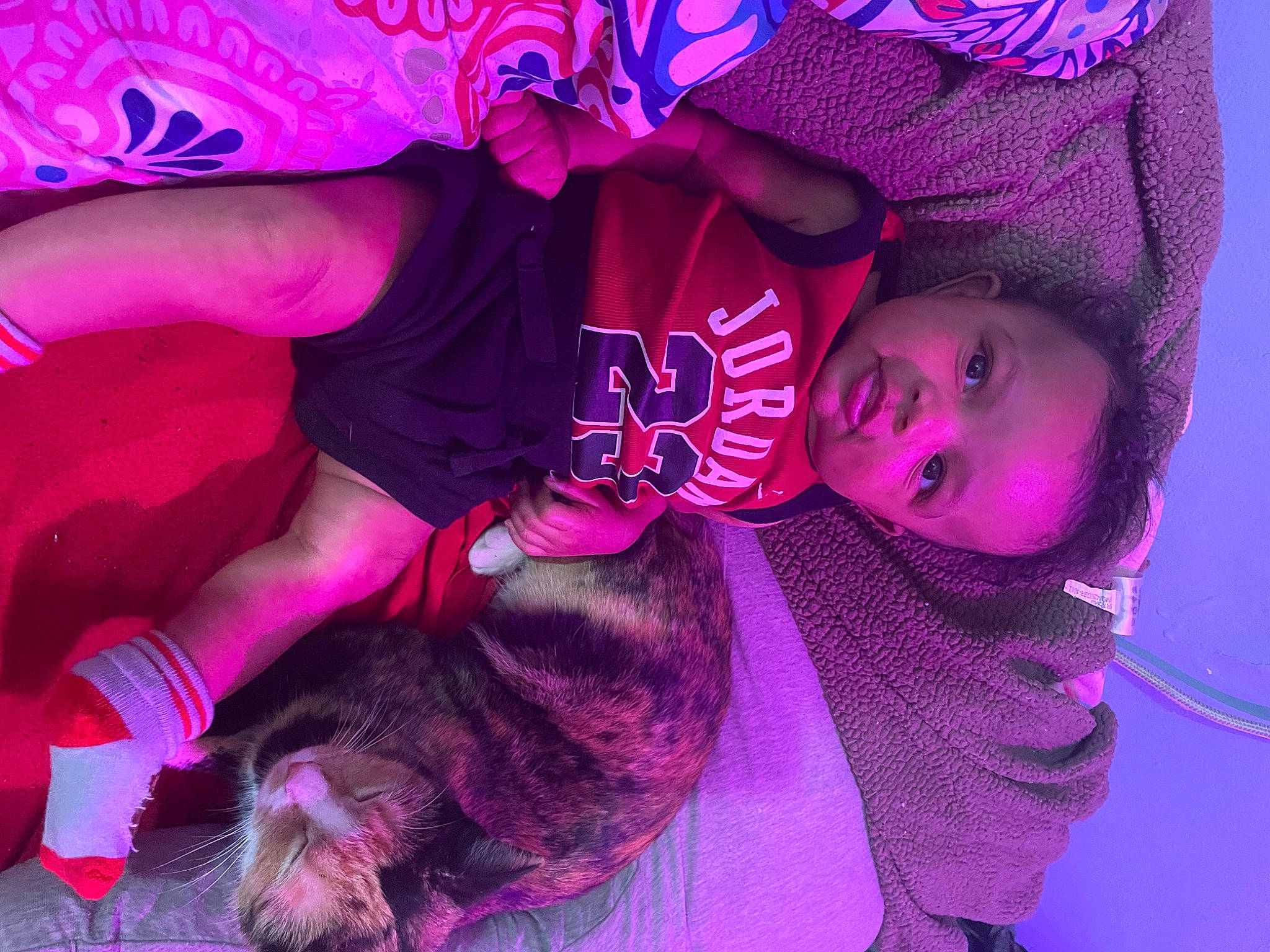 Jordon is registered to the contest to win money with this photo: baby, baby_toddler_clothing, child, companion_dog, event, felidae, fun, fur, hat, magenta, person, pink, plant, purple, red, sleeve, toddler, tree, violet