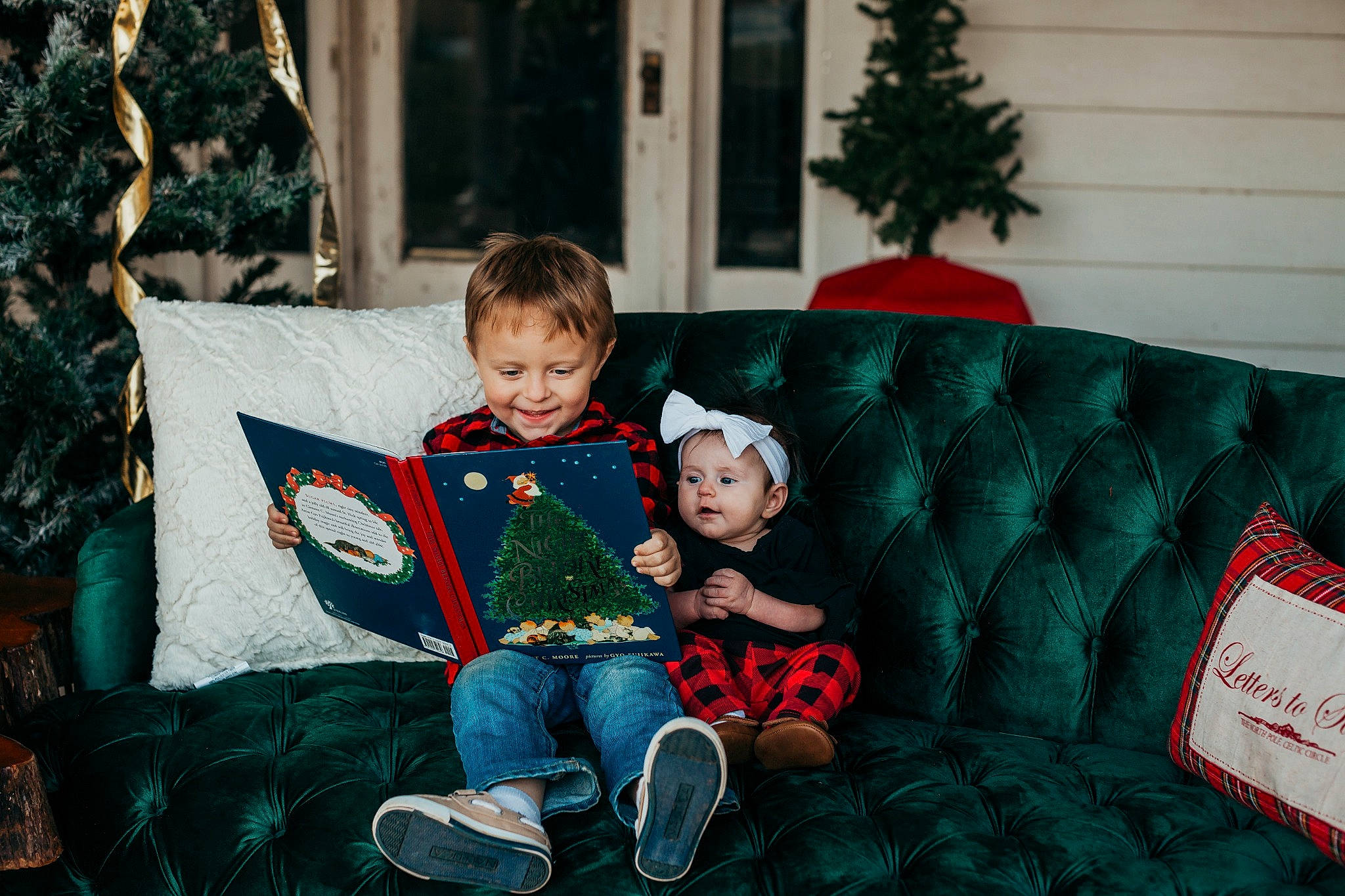 Aryanna joined the competition — help win amazing prizes! baby_toddler_clothing, child, christmas, christmas_decoration, christmas_eve, comfort, couch, eye, holiday, home, human, human_body, interior_design, joy, lap, living_room, person, reading, sitting, throw_pillow