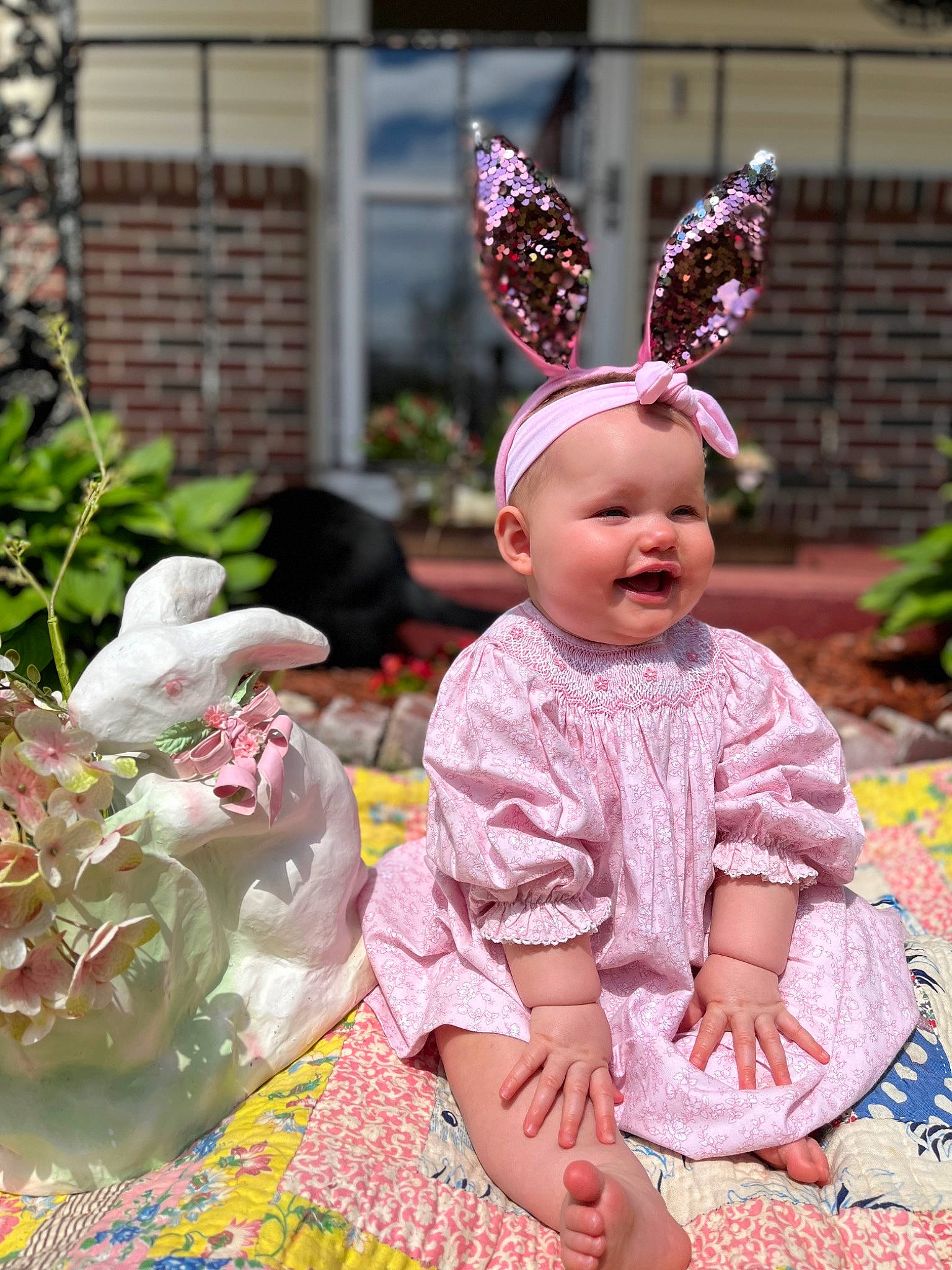 Gracy joined the competition — help win amazing prizes! baby, baby_toddler_clothing, child, costume_hat, event, fashion_accessory, fawn, grass, green, happy, headpiece, magenta, pattern, person, pink, plant, purple, sitting, smile, toddler