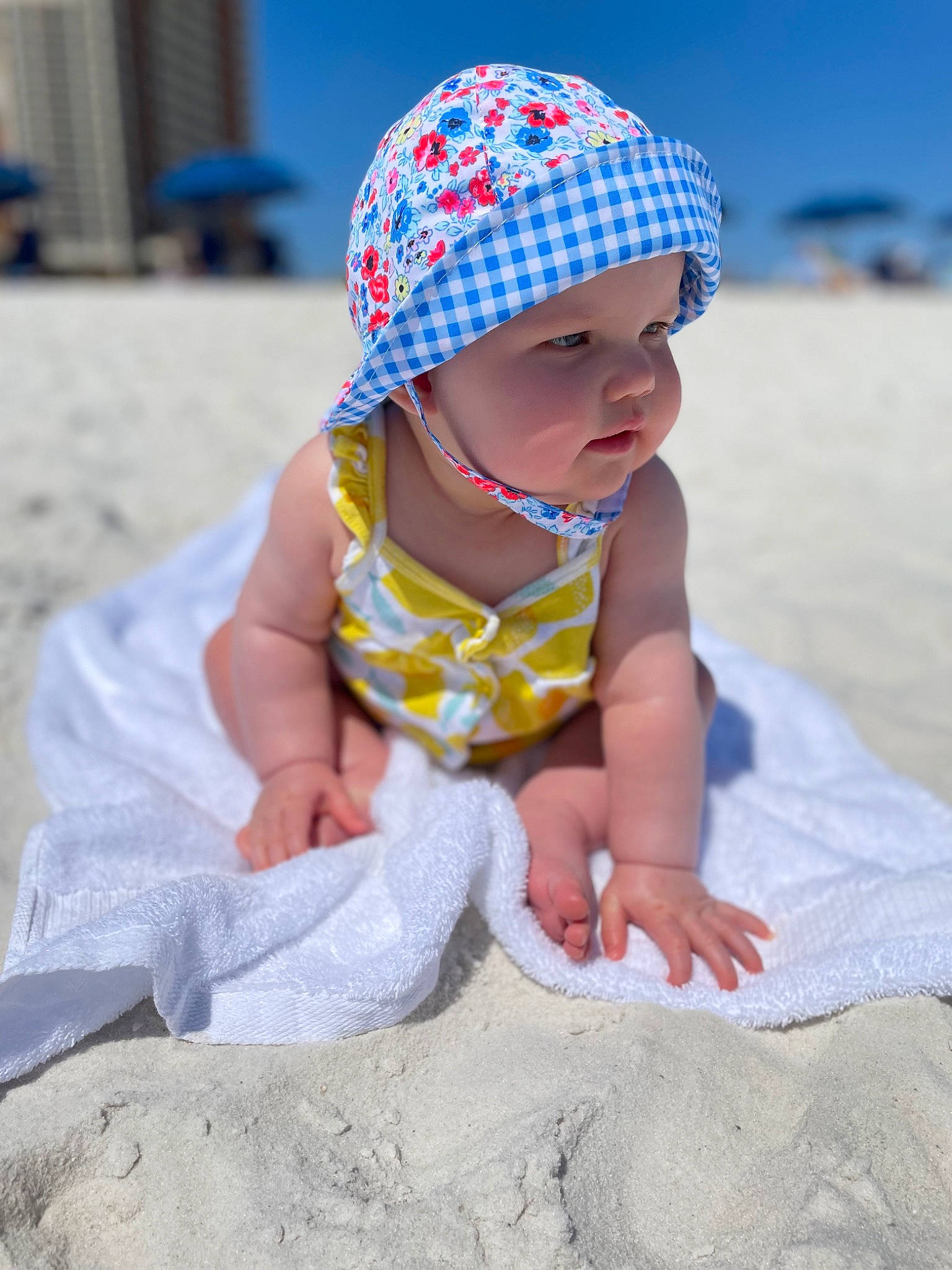 Gracy joined the competition — help win amazing prizes! azure, baby, baby_toddler_clothing, beach, blue, body_of_water, cap, child, fun, happy, headgear, headwear, leisure, people_in_nature, people_on_beach, person, photograph, sand, skin, sleeve