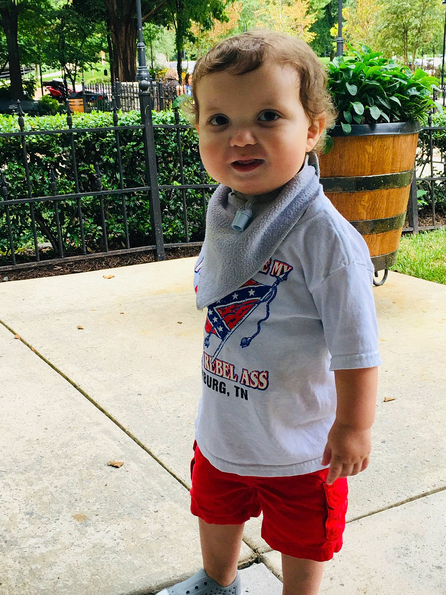 Preston is registered to the contest to win money with this photo: child, cool, face, fun, head, leisure, lip, person, plant, play, recreation, shorts, skin, sleeve, smile, summer, t_shirt, toddler, tree, vacation