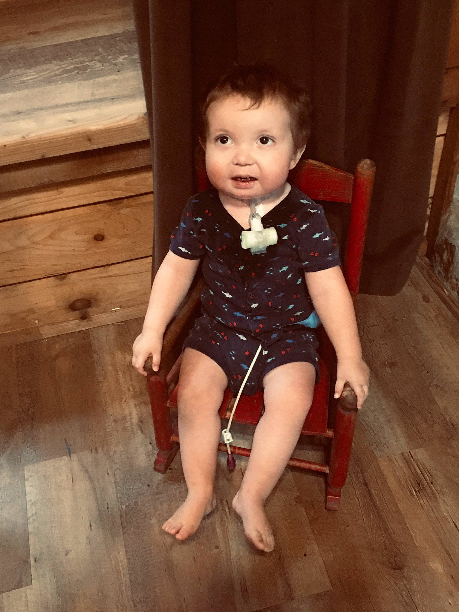 Preston is registered to the contest to win money with this photo: barefoot, child, floor, flooring, human_leg, leg, person, sitting, skin, standing, thigh, toddler, wood