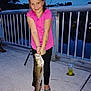Zaylee joined the competition — help win amazing prizes! child, girl, fish, fishing, water, evening, outdoor, smile, pink_shirt, flip_flops, concrete, railing, bracelet, tattoo, nature, trees, recreational, catch, happy, portrait