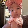Leilani joined the competition — help win amazing prizes! baby, child, pink_bow, headband, ruffled_sleeves, plush_toys, stuffed_animals, indoor, person, cute, infant, portrait, soft_lighting, home, decor, hand, face, looking_at_camera, clothing, adorable