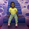 Nyleah joined the competition — help win amazing prizes! toddler, child, stairs, purple, bubbles, smiling, yellow_shirt, green_pants, pink_sneakers, hello_kitty, indoor, portrait, happy, casual_clothing, colorful, playful, fun, cute, young_child, fashion