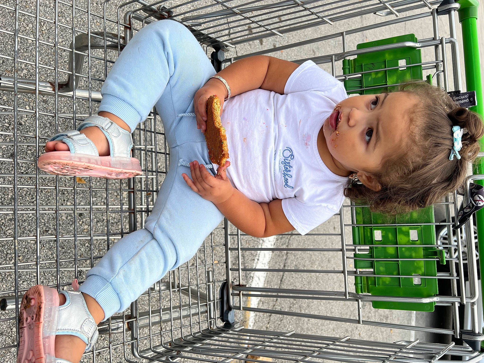 Jeslyn is registered to the contest to win money with this photo: child, elbow, eyewear, fun, grass, happy, hat, human_leg, leisure, pattern, person, recreation, sitting, snapshot, street_fashion, surprise, t_shirt, thigh, toddler