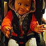 Edward joined the competition — help win amazing prizes! baby, baby_shoes, car_seat, child, cute, expression, footwear, grey_pants, hands, hood, hoodie, indoor, infant, orange_clothing, person, seatbelt, smiling, sneakers, straps, young_child