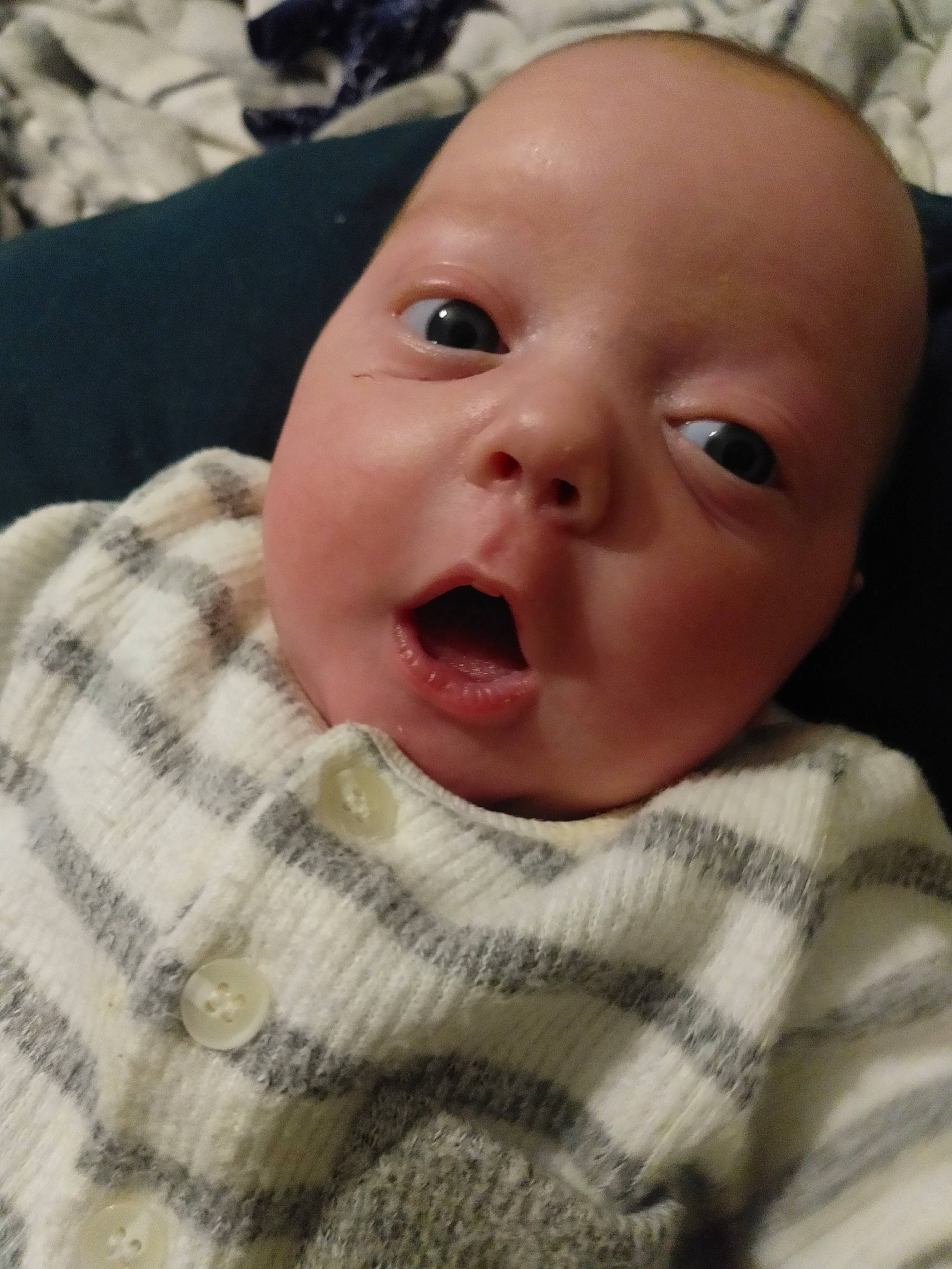 Dragos is registered to the contest to win money with this photo: baby, baby_toddler_clothing, cheek, child, chin, eyebrow, eyelash, facial_expression, forehead, iris, jaw, lip, mouth, nose, organ, person, skin, sleeve, sweater, toddler