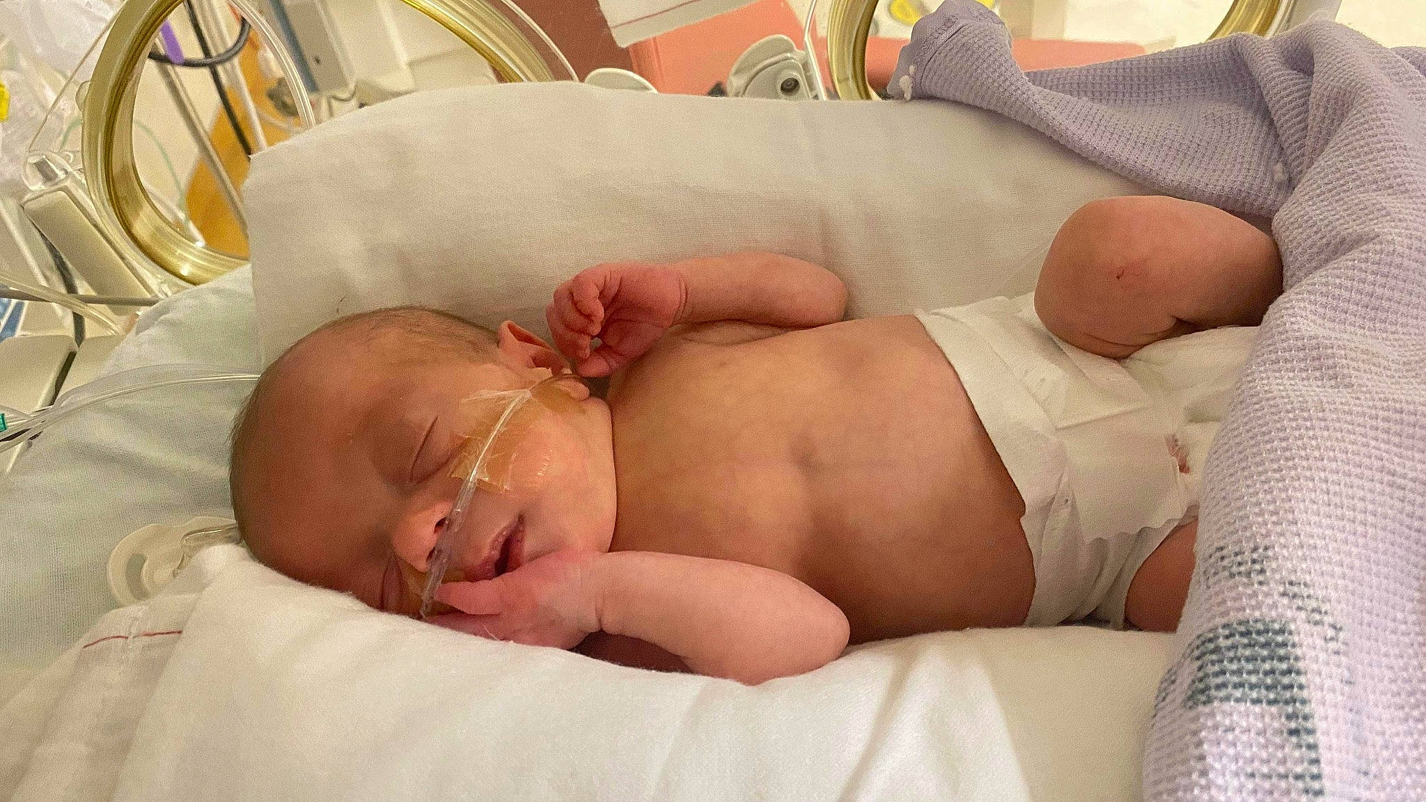 Danny is registered to the contest to win money with this photo: abdomen, baby, baby_products, baby_sleeping, baby_toddler_clothing, birth, child, childbirth, comfort, diaper, foot, hospital, hospital_bed, nap, person, skin, sleep, stomach, toddler, toe