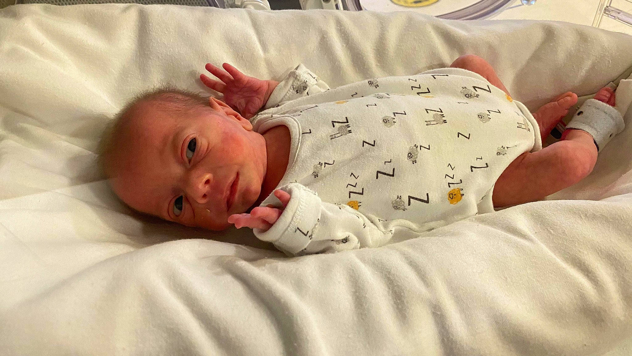 Danny is registered to the contest to win money with this photo: baby, baby_products, baby_toddler_clothing, bed, bed_sheet, bedding, bedtime, blanket, child, comfort, human, linens, person, skin, toddler