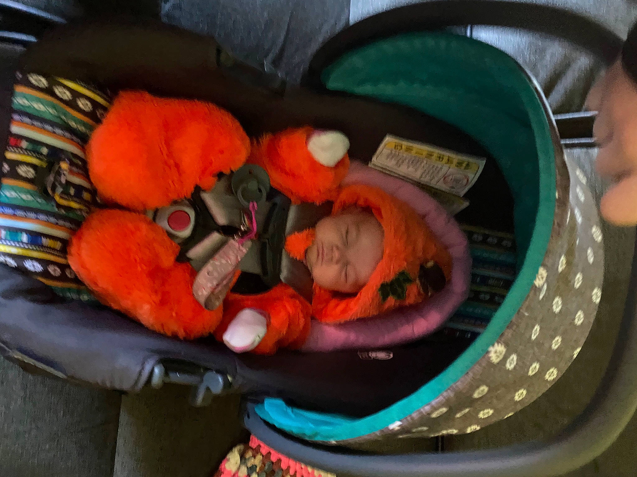 April is registered to the contest to win money with this photo: baby, baby_carriage, baby_products, baby_toys, bathing, car_seat, chair, child, circle, comfort, fun, headwear, infant_bed, orange, person, personal_protective_equipment, plastic, room, stuffed_toy, toddler