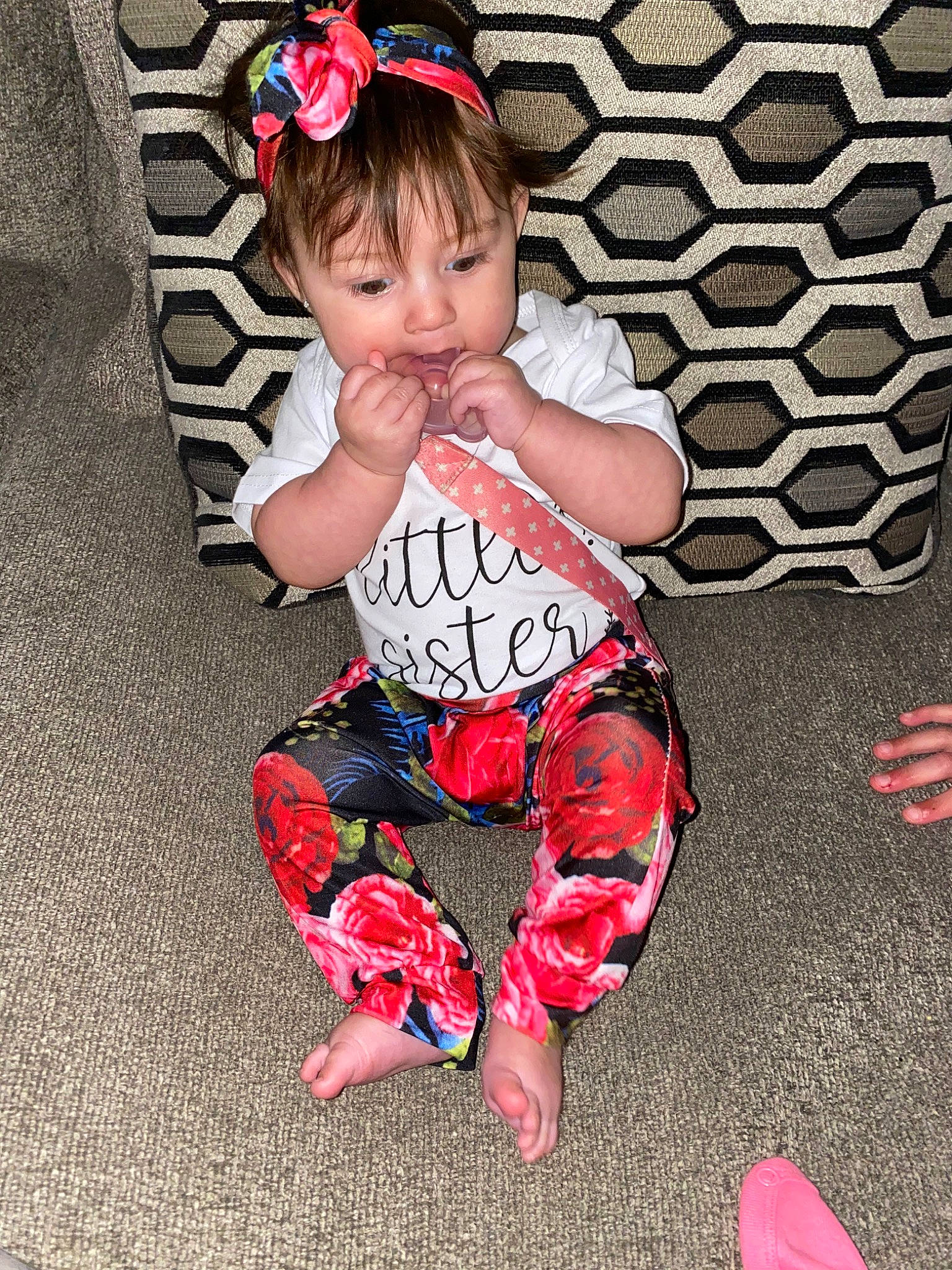 Mariah is registered to the contest to win money with this photo: baby, baby_toddler_clothing, child, costume, fashion_accessory, hair_accessory, headband, leg, pattern, person, pink, play, sitting, toddler
