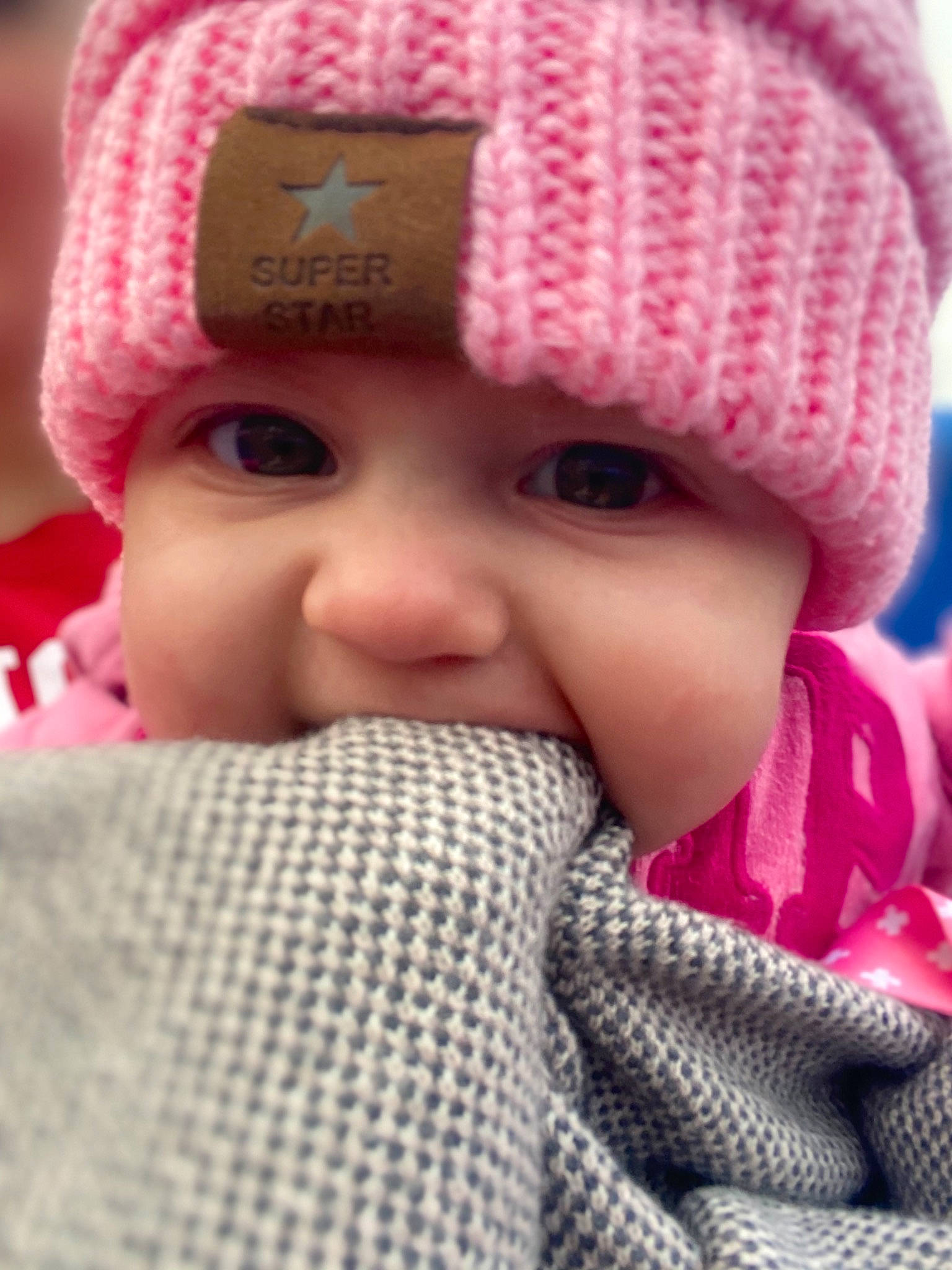 Mariah joined the competition — help win amazing prizes! baby, beanie, bonnet, cap, cheek, child, close_up, crochet, face, headgear, headwear, knit_cap, knitting, lip, nose, person, pink, skin, textile, toddler