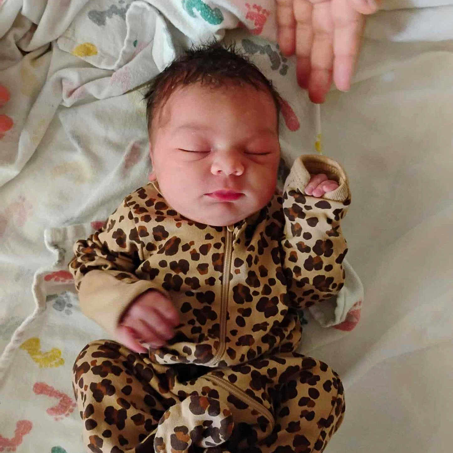 Airitrea is registered to the contest to win money with this photo: architecture, baby, bed, blanket, building, clothing, cushion, face, furniture, glove, head, homedecor, hospital, newborn, pajamas, person, photography, portrait, quilt, sleeping