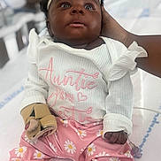 Kamilla joined the competition — help win amazing prizes! baby, infant, child, headband, bow, pink_pants, floral_pattern, white_shirt, medical_glove, iv_line, hand, sitting, indoors, bed, cute, portrait, person, clothing, expression, support