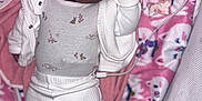 Kamilla is registered to the contest to win money with this photo: baby, infant, child, blanket, pink, white_clothing, onesie, pants, lying_down, face, curly_hair, baby_accessories, pacifier, soft_toys, crib, cozy, cute, portrait, indoors, sleepwear