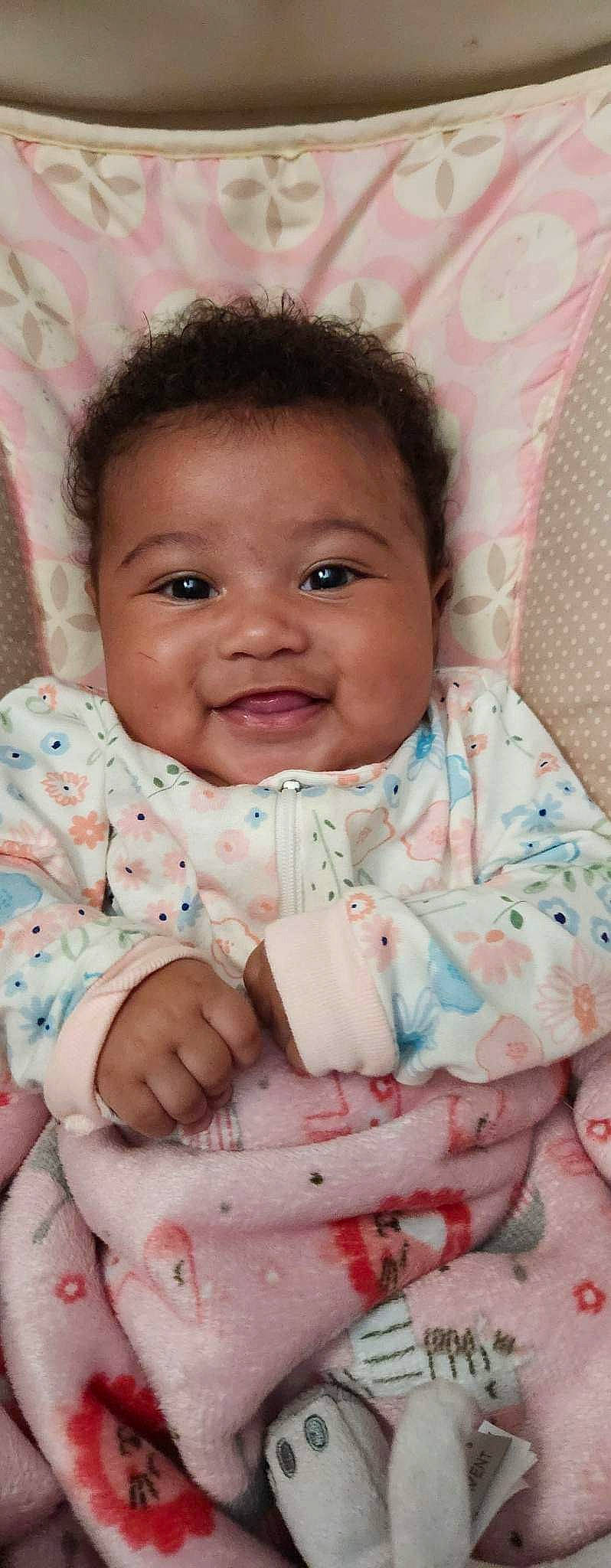 Zalayah is registered to the contest to win money with this photo: arm, baby, baby_toddler_clothing, cheek, chin, collar, dress, eye, face, gesture, happy, iris, joy, lip, mouth, nose, person, pink, skin, sleeve