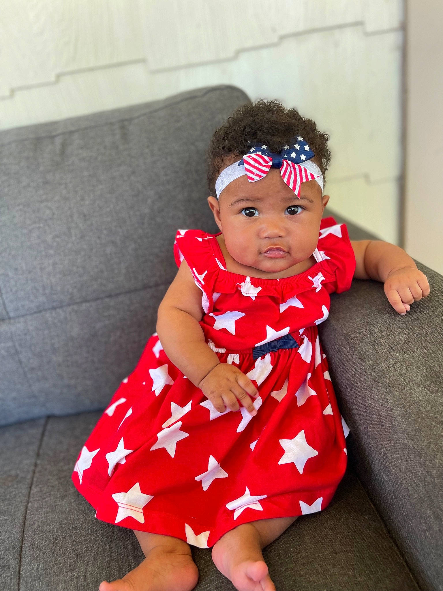 Zalayah joined the competition — help win amazing prizes! baby, baby_toddler_clothing, carmine, child, couch, day_dress, dress, fashion_design, goggles, happy, hat, headband, human_leg, magenta, one_piece_garment, pattern, person, sitting, sleeve, thigh