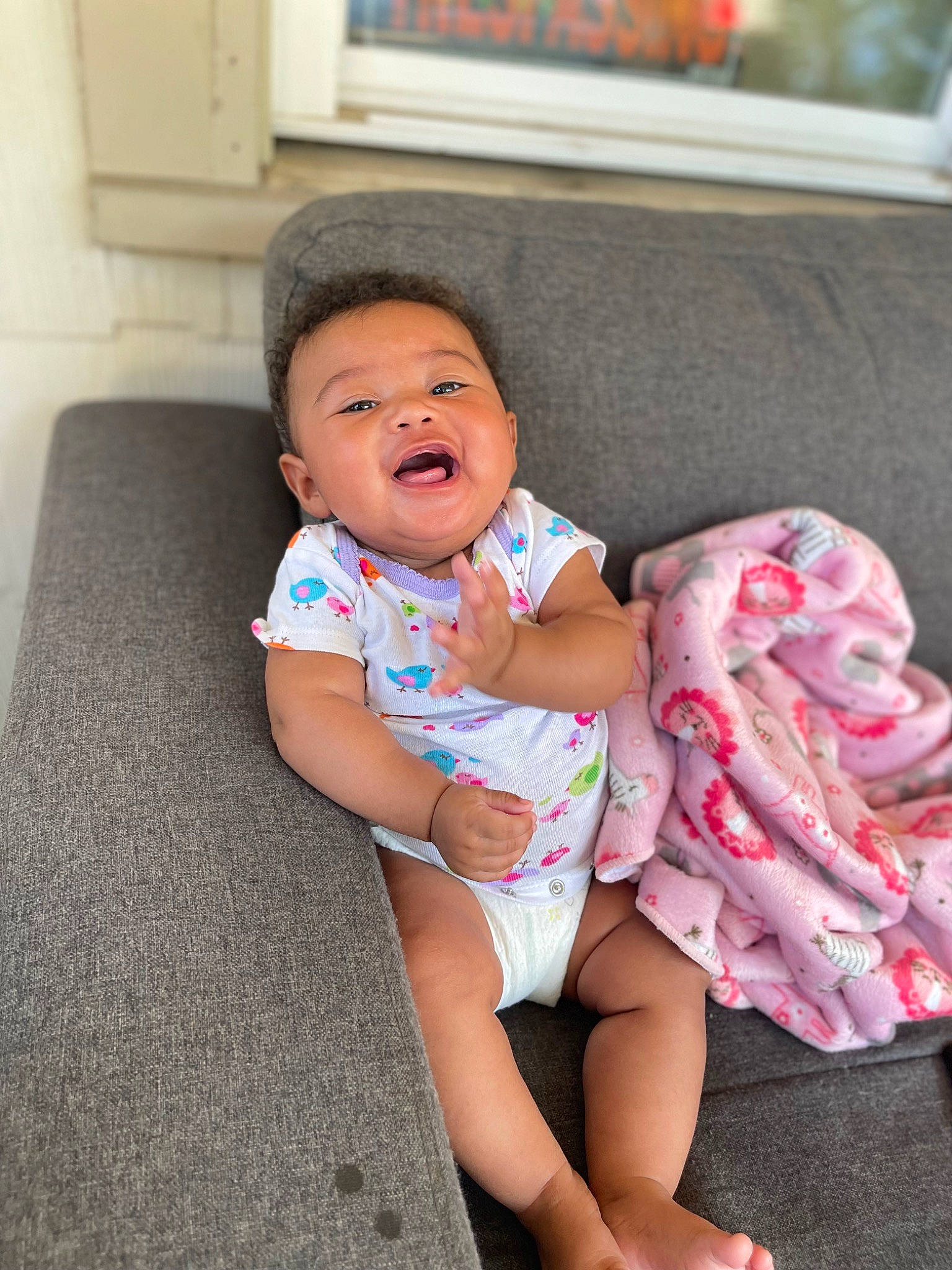 Zalayah joined the competition — help win amazing prizes! baby, baby_toddler_clothing, cheek, child, comfort, couch, eye, face, foot, happy, head, human_body, human_leg, knee, leg, mouth, person, shoulder, skin, thigh