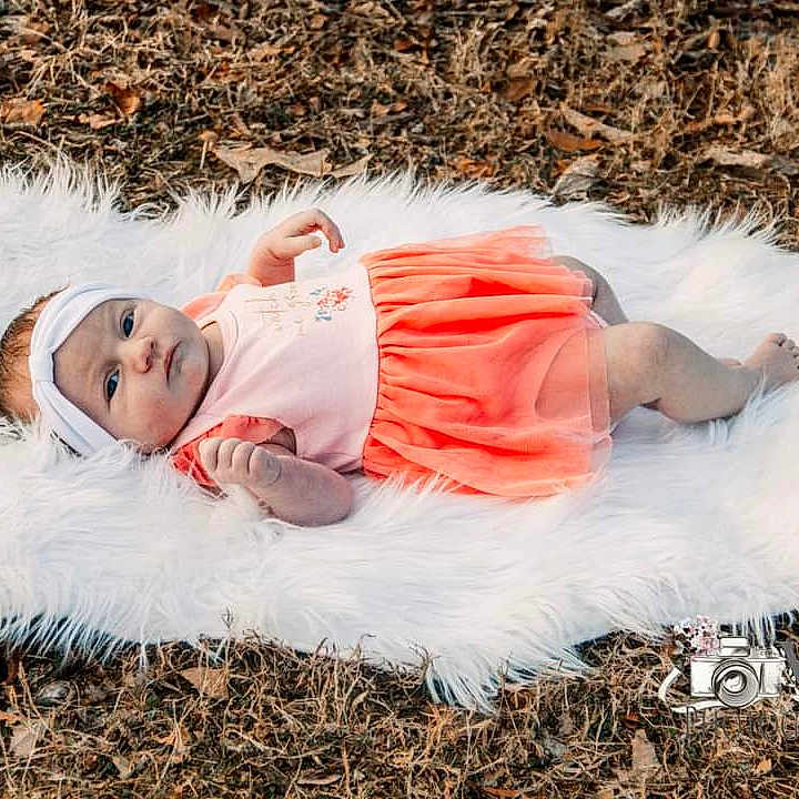 Jaylin is registered to the contest to win money with this photo: baby, ball, blanket, clothing, cushion, dress, face, football, head, homedecor, newborn, person, photography, pillow, portrait, quilt, sleeping, soccer, soccerball, sport