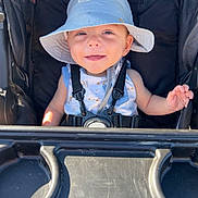 Roan joined the competition — help win amazing prizes! baby, child, stroller, hat, smile, happy, babytrend, harness, outdoor, sunlight, infant, blue_hat, seat, plastic_tray, cute, young_child, expression, baby_clothing, baby_accessory, portrait