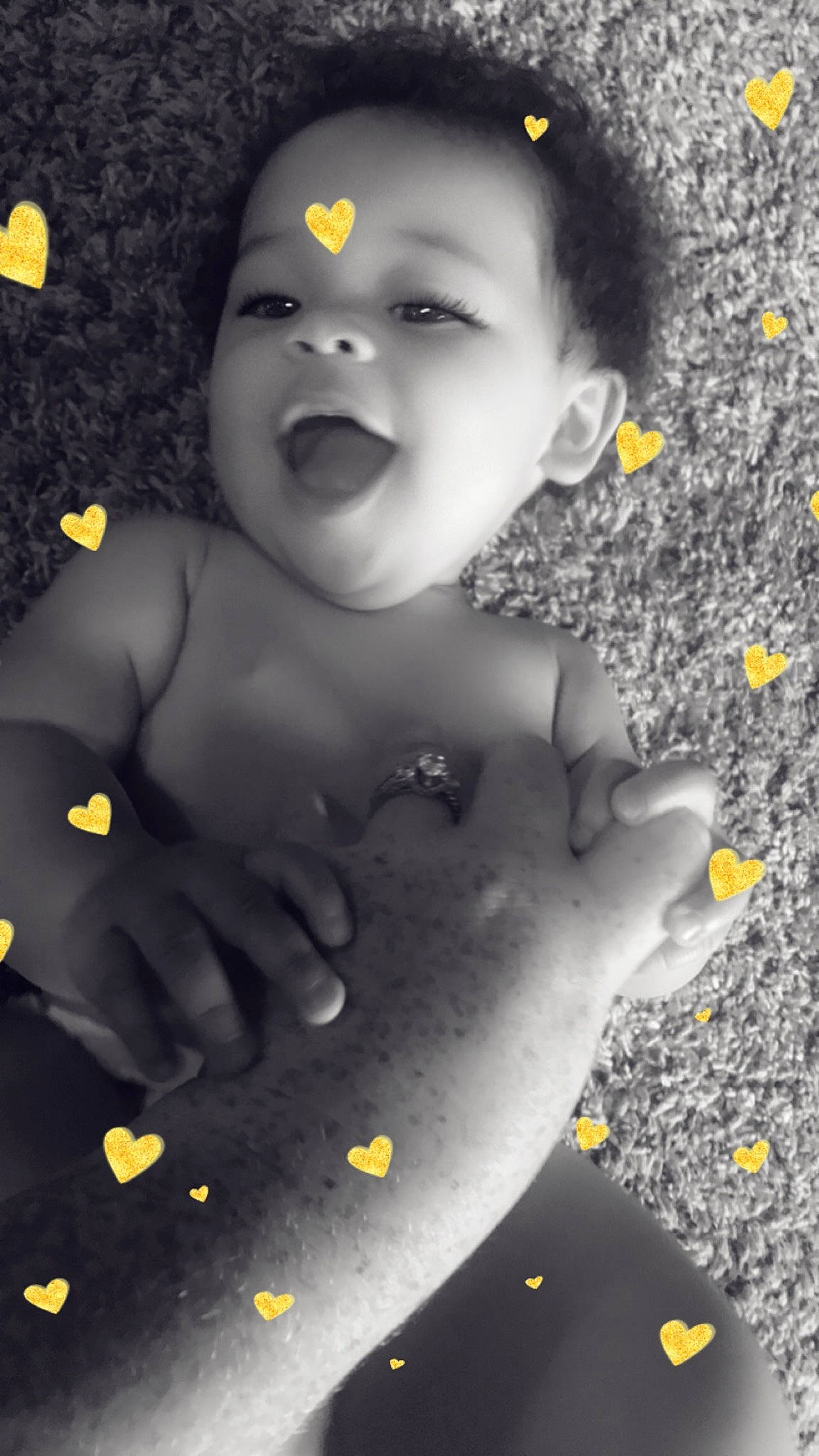 Aliyah is registered to the contest to win money with this photo: baby, black, black_and_white, black_hair, child, eye, lip, mouth, nose, person, photography, smile, toddler, yellow