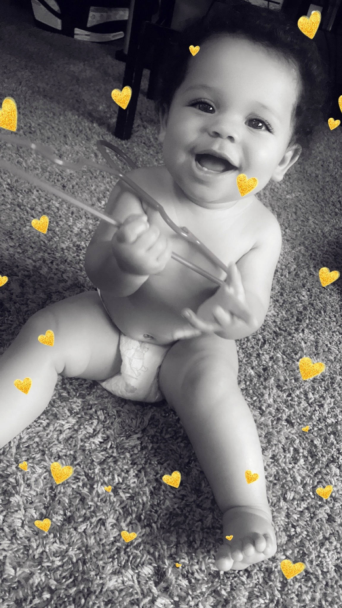 Aliyah is registered to the contest to win money with this photo: baby, black_and_white, child, leg, person, photograph, photography, play, skin, smile, snapshot, toddler, yellow